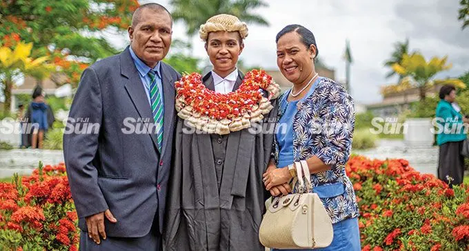 Newly sworn in legal practitioner Merelita Seru Nagera is flanked by her parents Ifereimi Nagera (father ) and Rusila Nagera (wife) during the swearing in ceremony for new legal practitioners at the High Court in Suva on 18 March 2022. Photo: Leon Lord