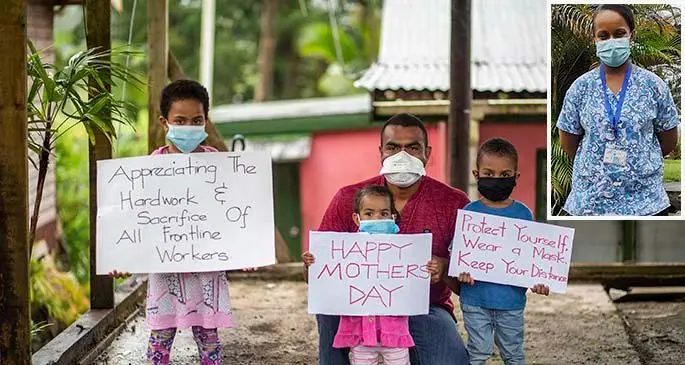From left: Luisa Wainiqolo 6, Eremasi Wainiqolo 3, Asela Wainiqolo 1, with dad Aquila Wainiqolo hold up signs in Coloi-Suva on May 8, 2021 in support to front liners especially their mum who is a nurse and away from them during Mothers Day. Photo: Leon Lord INSET: Staff nurse and mother Aqela Matai Wainiqolo.
