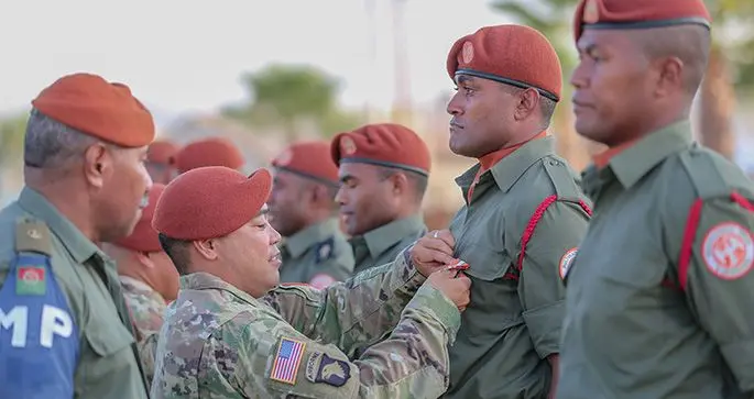 Commanding Officer US Southern Battalion Lieutenant Colonel David Santos pins the MFO medal on Private Apisai Domolailai. Photo: Captain Mark Scott