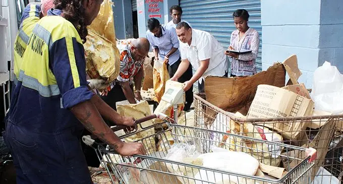 Staff of the Nasinu Town Council and Consumer Counci of Fiji load the truck with rotten meat taken from Hansons Supermarket in Makoi, Nasinu, on June 4, 2019.  Photo: Shalveen Chand