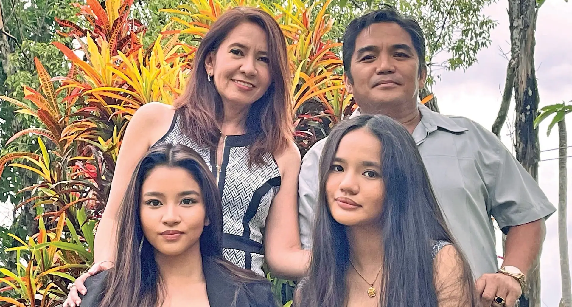 Florecilla Ecube (standing left) with her husband, Donald Ecube and daughters, Bea and Ruth Ecube.