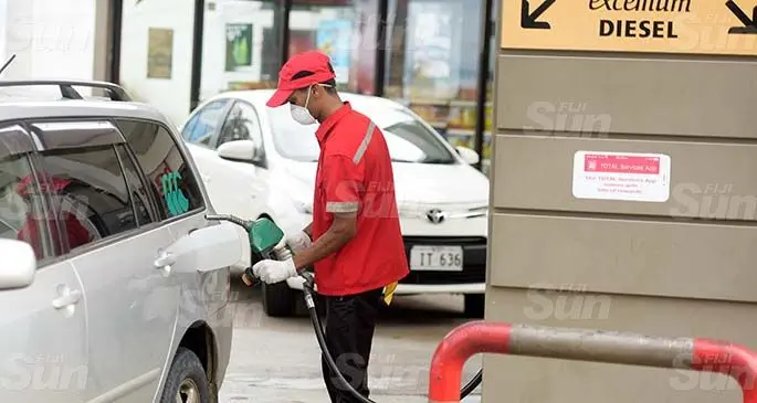 James Robin fill up fuel for a cutomer at a Total Service Station iin Suva . Photo: Ronald Kumar.