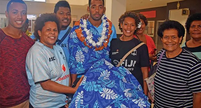 Fiji Airways Fijian 7s forward Isoa Tabu is traditionally welcomed by his family at Nadi International Airport on March 13, 2019. He will play for Ra- vuka Sharks at the Fiji Bitter Marist 7s this weekend. Photo: Waisea Nasokia