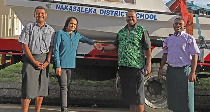 Minister for Education, Heritage and Arts Rosy Akbar (second from left) handing over the boat as part of Government’s transport assistance to Nakasaleka District School in Kadavu. Photo: DEPTFO News