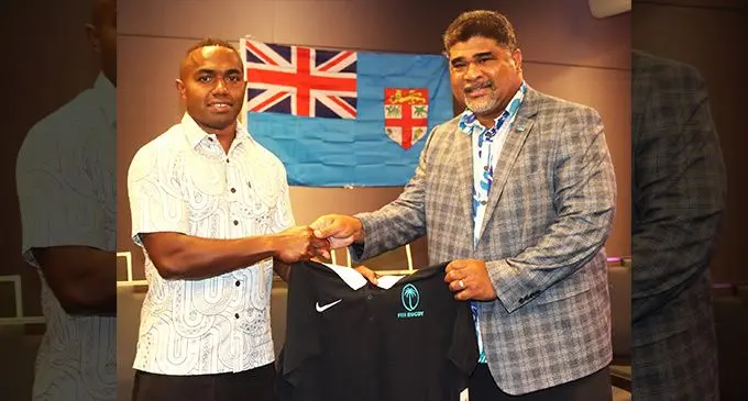 From left: Fiji Airways Fijian men’s rugby sevens captain Waisea Nacuqu receives his jersey from the Fiji High Commissioner to Australia David Kolitagane in Sydney on January 26, 2023. Photo: FRU Media