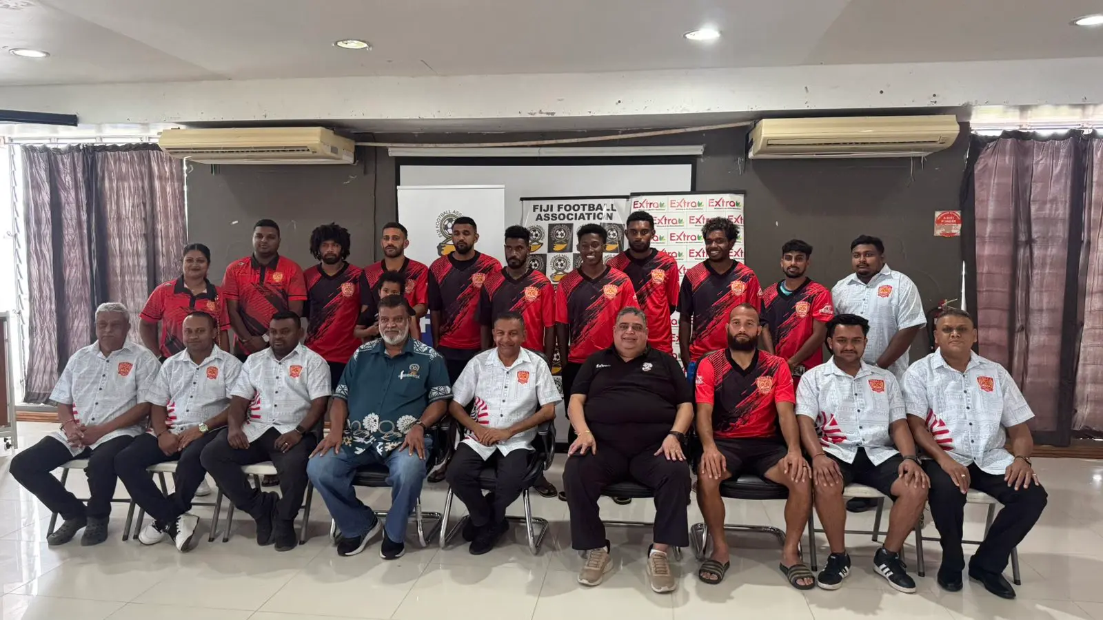 Fiji Football Association chief executive officer Mohammed Yusuf (sitting fourth from left), Rewa FC vice-president Sanjay Prasad (fifth), Fiji FA president Rajesh Patel (fourth from right) and Rewa FC head coach Tevita Waranaivalu (third from right) with the Rewa team and management in Suva on July 30, 2026. Photo: Tevita Wesele