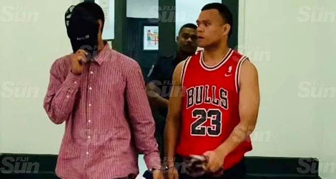 Samuela Bokadi, 22, (right) outside the High Court in Suva. Photo: Fonua Talei