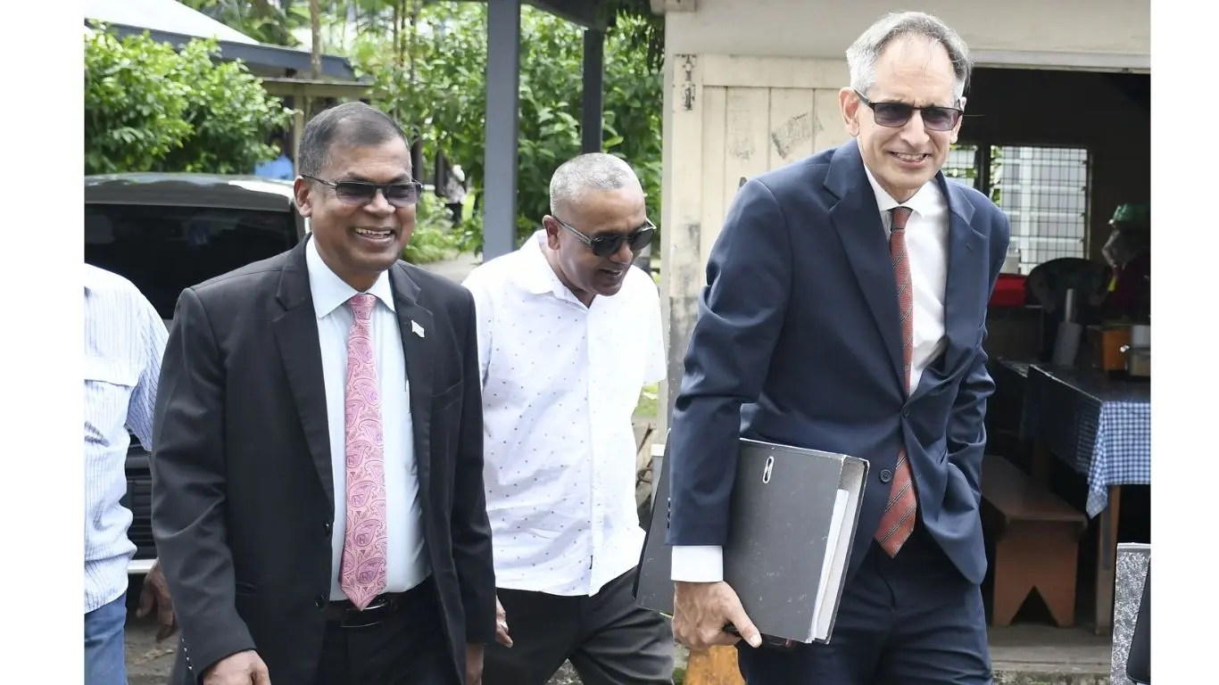 Former Deputy Prime Minister Biman Prasad with lawyer Richard Naidu outside the Suva Courthouse on April 20, 2026. 