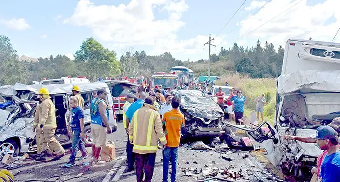 Fire officers at the scene where the three-vechicle smash up took place at Nabou in Nadroga yesteday. Photo: WAISEA NASOKIA