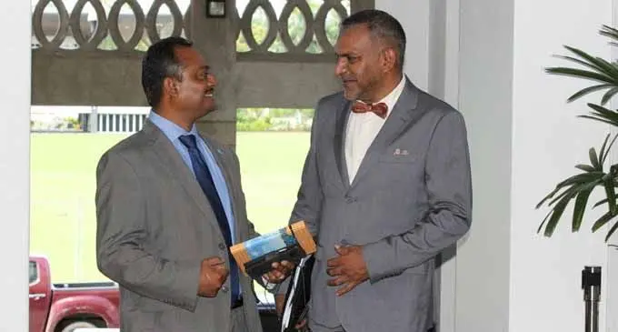 Minister for Indsutry, Trade, Tourism, Lands and Mineral Resources Faiyaz Koya (right) and assistant Minister for Infrastructure and Transport Vijay Nath outside Parliament on March 12, 2018  Photo: Parliament of Fiji 