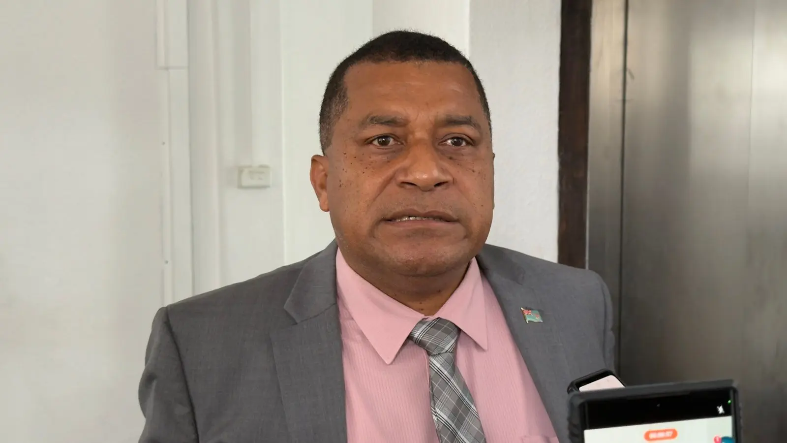 Maciu Nalumisa speaks to reporters in Parliament on November 3, 2025.