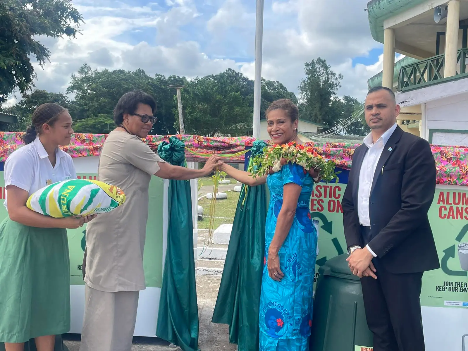 Minister for Information, Environment and Climate Change Lynda Tabuya (wearing a garland) with Permanent Secretary for Environment and Climate Change Dr Sivendra Michael (right), alongside staff and students of Ratu Sukuna Memorial School.