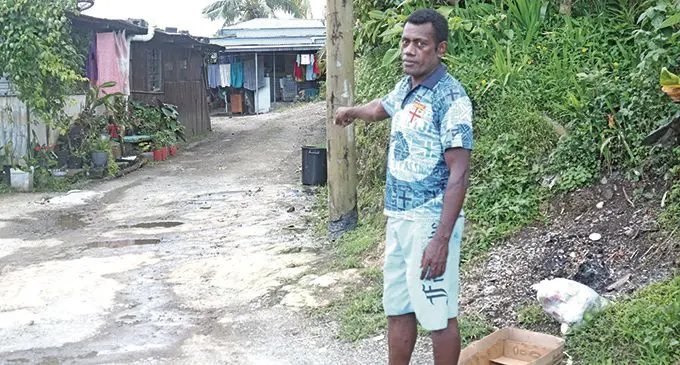 Anasa Koroitamana points at the driveway where a young man was bitten by stray dogs at Newtown, Nasinu on October 4, 2020.  Photo: Kelera Sovasiga