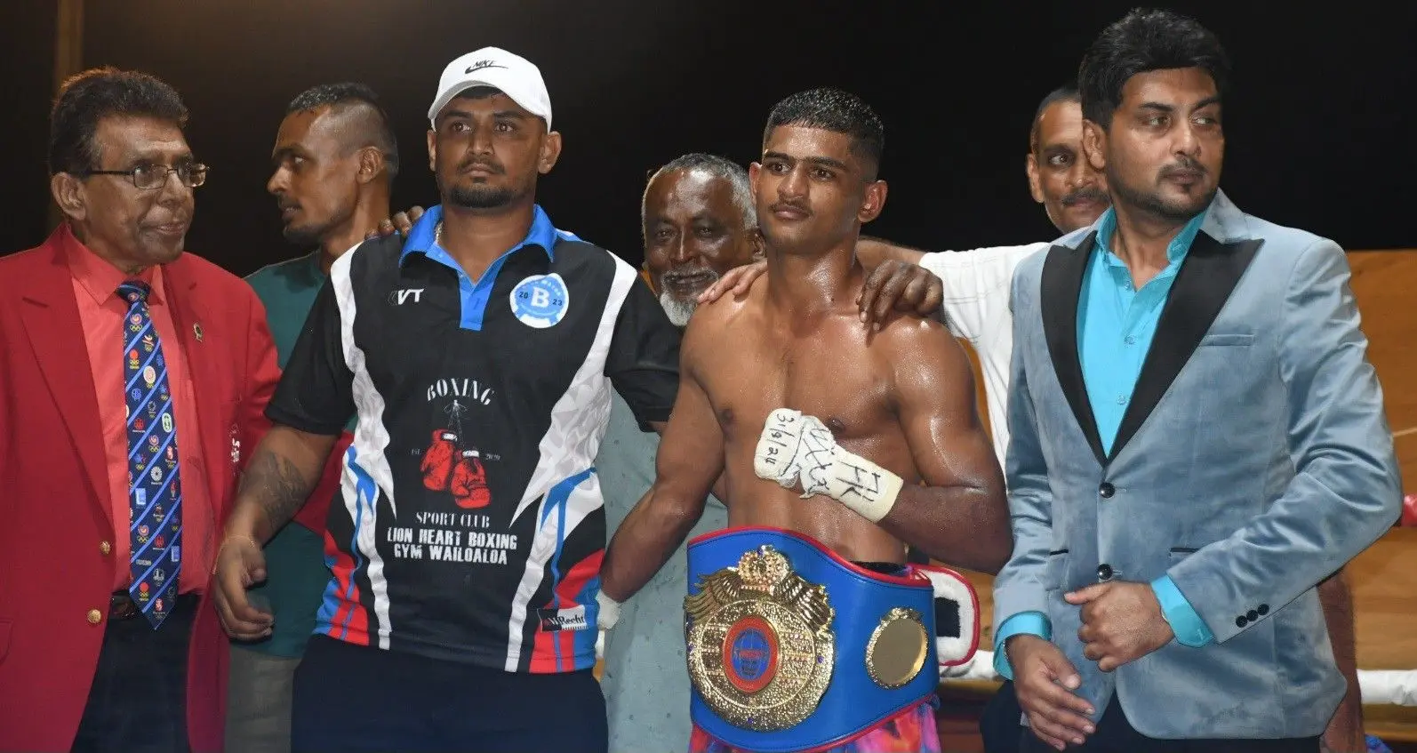 Boxing of Fiji chairman Adi Narayan (far left) with WBA Oceania Interim Super Bantamweight Champion Binnu Singh (with belt) during the Blue Water Boxing Promotions last year.