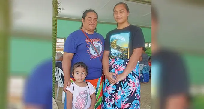 Susan Taukave with her daughters Kimberly Lavon (left) and Taukave Lavon (in front) after opening a new bank account with BSP.. Photo: Josefa Babitu