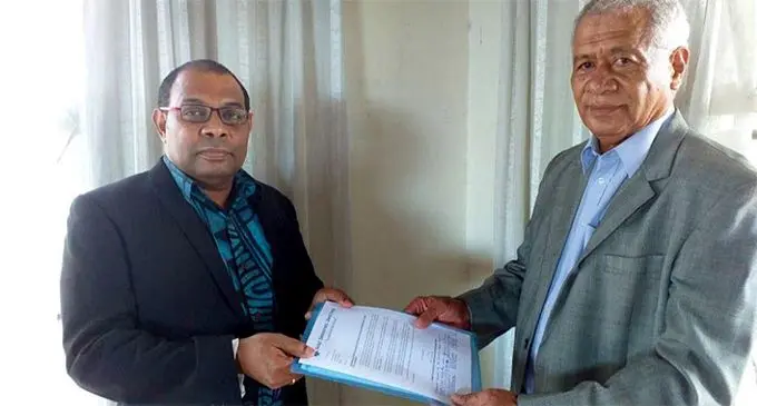 Mesake Nawari (left ) receives his appointment letter from the Acting President of SODELPA Anare Jale.