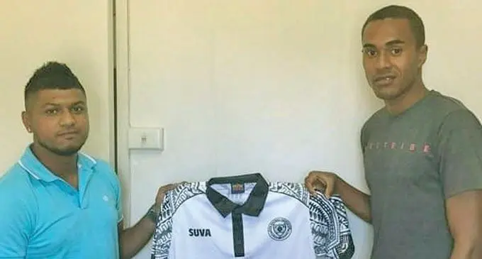 Suva FC official Ravneel narayan (left) presents Gabiriele Matanasiga’s jersey on January 12, 2021. Photo: Suva FC