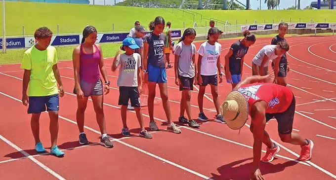 Former Pacific sprint champion Banuve Tabakaucoro teaches athletes during the Fiji Sports Council off-season athletics camp. Photo: Fiji Sports Council