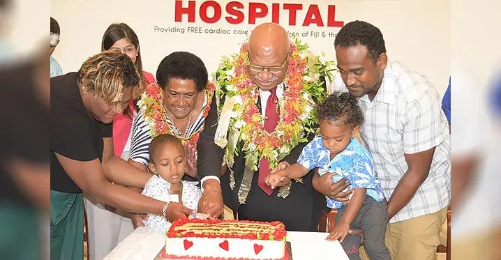 From left: Kelera Buaserau with son Mikaele, Hospital director Dr Krupali Tappoo, Suluweti Rabuka, Prime Minister Sitiveni Rabuka and Ilatia Konatora with son Uraia cut a cake to mark 100 heart surgeries at Sai Sanjeevani Children Heart Hospital on February 2, 2023. Photo: Ronald Kumar