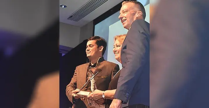 Vomo Island Fiji director of Sales and Marketing, Karen Marvell (middle) receives the award. Photo: Waisea Nasokia