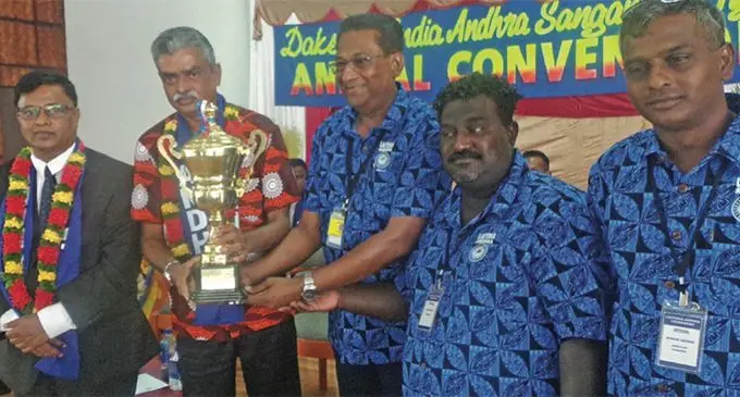 From Left: Acting Chief Justice Kamal Kumar, Assistant Minister for Rural Development, Waterways and Environment, and Chief Guest, Viam Pillay presenting a trophy to Lautoka Andhra for the highest membership on April 19, 2019. Photo: Rohit Kumar