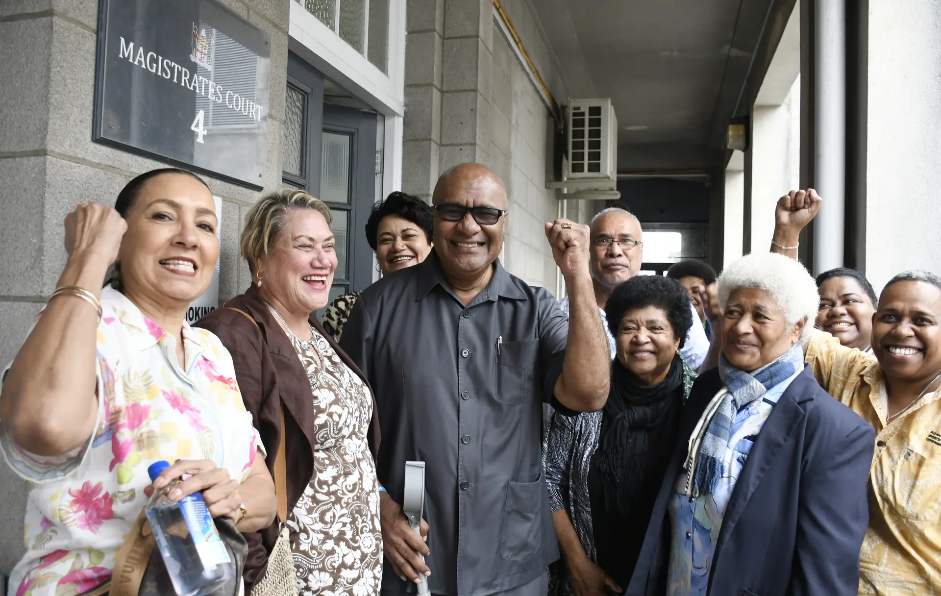 Manoa Kamikamica (third from left) celebrates with friends, family and supporters outside the Suva Magistrate Court on August 3, 2026, after he was cleared of all charges–perjury and providing false  information. Ph