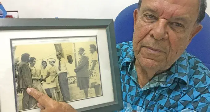 Paul Jaduram on September 9, 2022, showing his photo taken with the late Queen Elizabeth II and the late Duke of Edinburgh Prince Phillip. Photo: Shratika Naidu