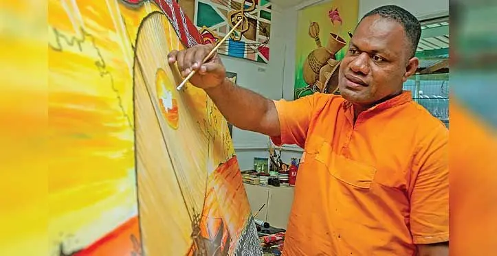 Fiji Corrections Service inmate Isoa Codrokadroka, with his work of art on display at the Tagimoucia Art Gallery in Suva on November 20, 2023. Photo: Leon Lord