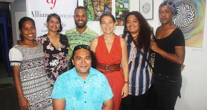 Standing (from left), Artists Arieta Rarakula, Sam Yunus Lino Lionel Colaitiniyara, Alliance Française director of culture and communications Pauline Ferté, Regina Shiki, Kirikiti Rasiga and Skillz (seated), at the art exhibition launch on February 27, 2020. Photo: Shreeya Verma
