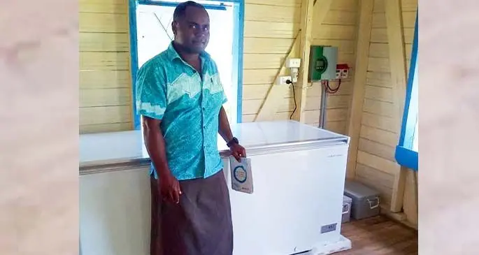 Revoni Rakasalu with the new solar-powered freezer at Natauloa Village, Narai. Photo: Manasa Colatanavosa