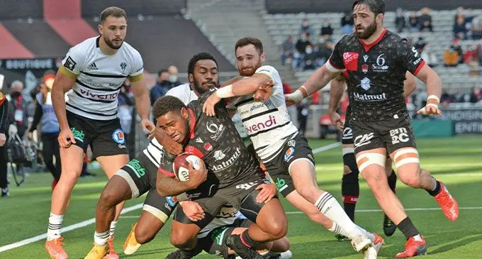 Lyon winger Josua Tuisova is tackled by Brive’s Setareki Tuicuvu during their Top 14 clash on December 4, 2021. Lyon won 41-0. Photo: Lyon Rugby