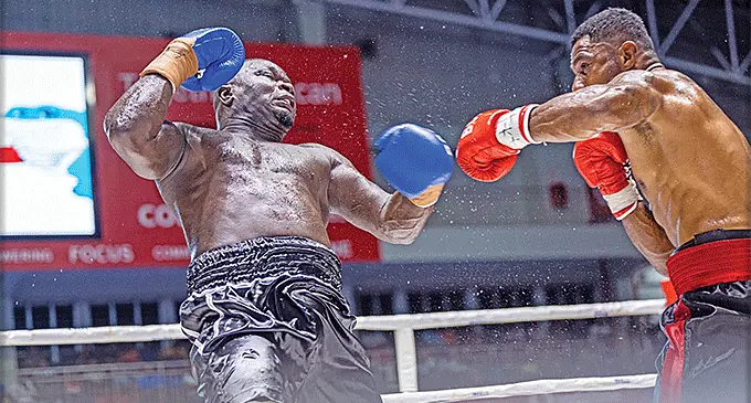 Cruiserweight boxer Alivereti Kauyaca (right) sends Joseph Kwadjo reeling during their fight at the Vodafone Arena, Suva, on march 2, 2024. Kauyaca won on points. Photo: Leon Lord