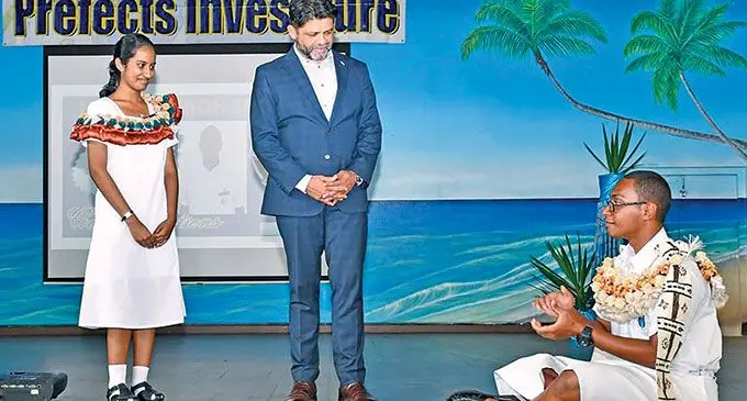 Newly-inducted Natabua High School head boy, Ratu Manoa Kaiyanuyanu (right) traditionally acknowledges the Attorney-General and Minister for Economy, Aiyaz Sayed-Khaiyum alongside the head girl, Inayah Ali following the prefects inductions on May 20, 2022. Photo: Fijian Government