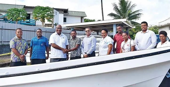 Third from left: Deputy Prime Minister and Minister for Trade, Co-Operatives and Small and Medium Enterprises and Communications, Manoa Kamikamica handover boat and engine to Noa Ravunibaka (shaking hands with) while Mikaele Batiuluna (second from the left) stood with guests at Asco Motors in Labasa on May 2, 2023.