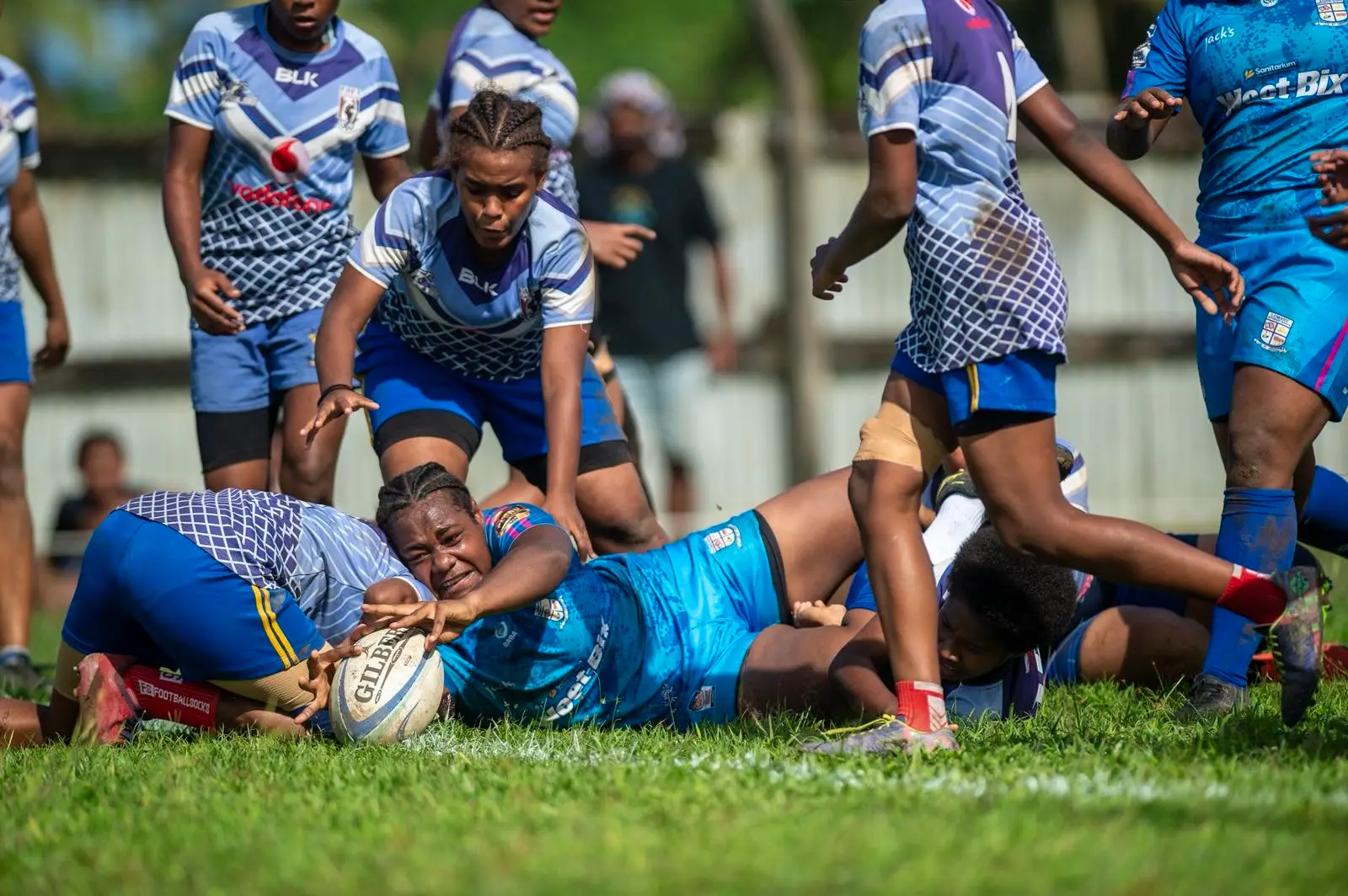 Emi Liliogo scores a try for Lomary Secondary School Under-18 rugby