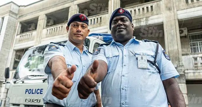 Constable Harish Lal (left), and Sergeant Nilesh Kumar made sure the children of St Marcellin Primary School reached home safely, pictured here in Suva on January 20, 2021. Photo: Leon Lord