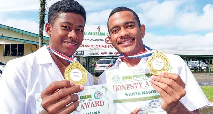 Nasinu Muslim College students Nereo Seruliwaliwa (left), and Waisea Nabobo after receiving their honesty awards on May 23, 2019.  Photo: Ronald Kumar