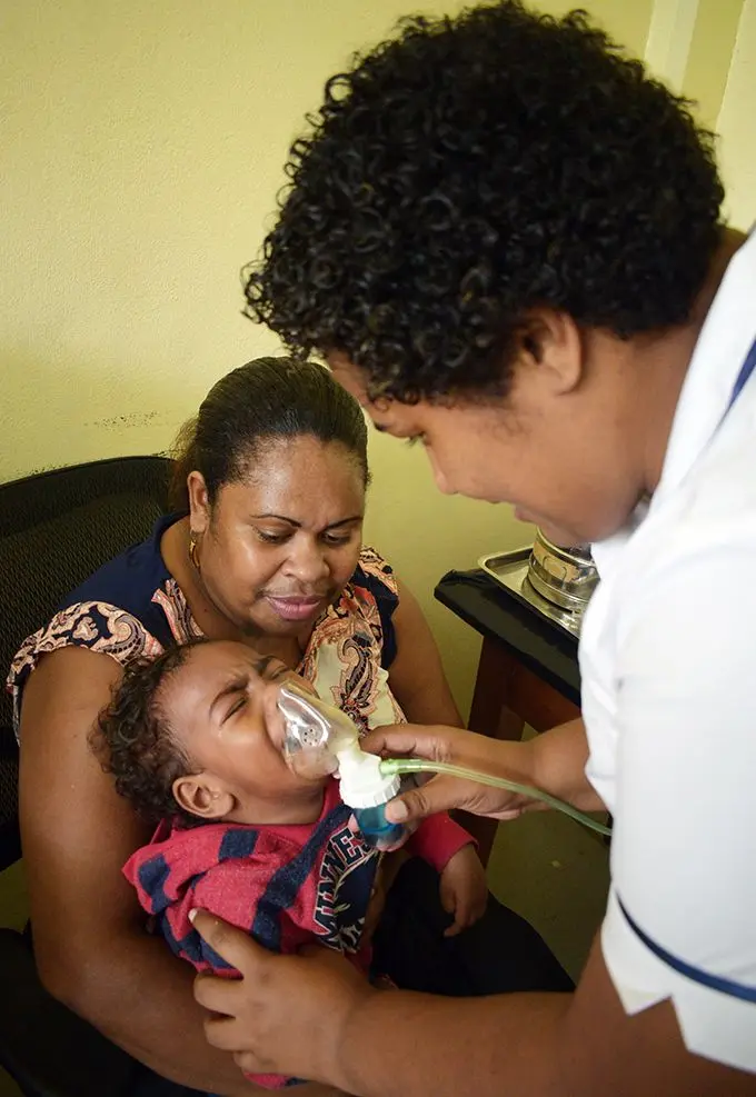 Lami Health Centre staff-Nurse Sera Naiti assist Unaisi Bewatu's year-old son, Sonia Bwatu in breathing on May 7, 2019. Photo: Ronald Kumar.
