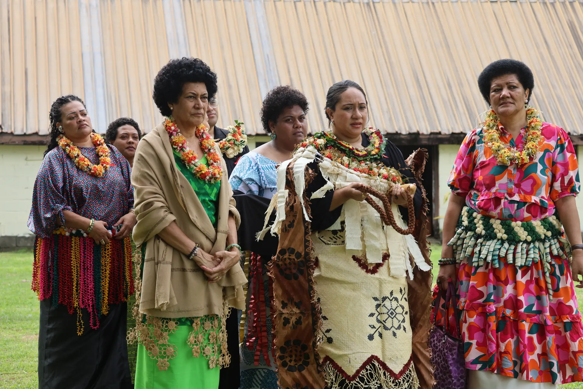 Sisters Adi Litia Mara Dugdale (left) and Adi Elenoa Mara (far right) escorting Adi Litia Mara Nailatikau as she presents a whale’s tooth (tabua) at her late father’s Vakataraisulu at Bau on July 25, 2025. Photo: Asenaca Ratu