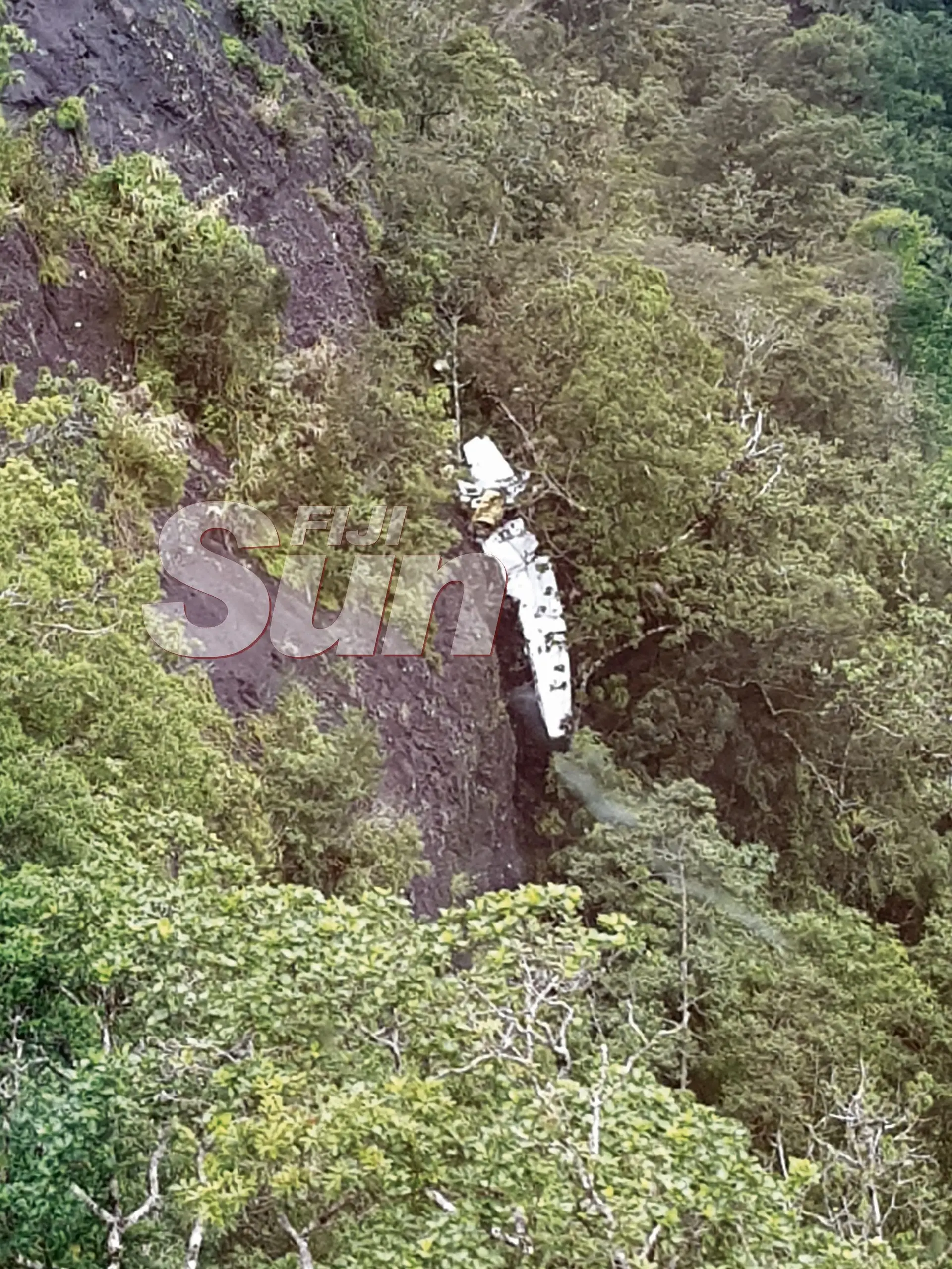 The Cessna 172 aircraft wreckage seen here hanging off a cliff on  the Delaikoro ridge.  Photo: Fiji Rescue Co-ordination Centre