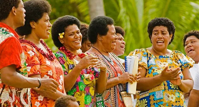 A warm and happy welcome from these singers on Kadavu Island, FijI. Image by Paul Harris / Getty Images