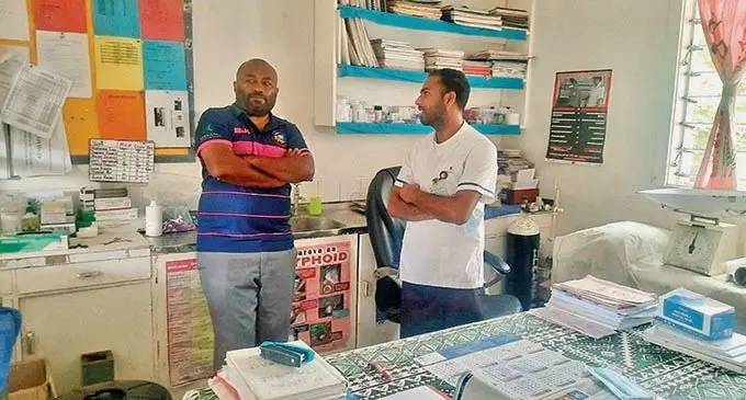 Staff Nurse Salvin Prasad of Naqalimare Nursing Station in Sigatoka meets with Minister for Health and Medical Services Dr. Ifereimi Waqainabete.