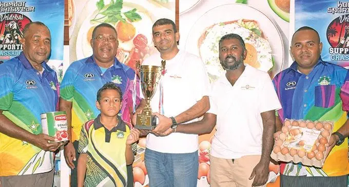 Kombat Uluinakau 7s tournament officials (from left) Jerry Qura, Epi Kolinivalu, Wilfred Kolinivalu and (right) Malakai Yamaivava receive the trophy and sponsorship from Ram Sami business development manager Abdul Sameer and national sales manager Avinesh Gopal at the Wallson Foods PTE Limited’s board room in Valelevu, Nasinu on December 5, 2020. Photo: Ronald Kumar