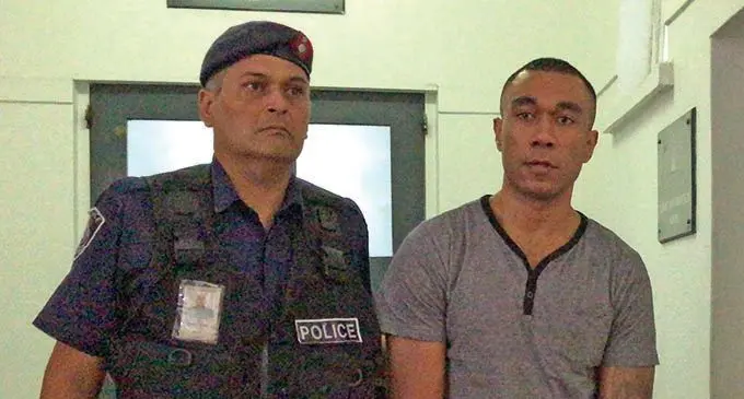 Rusiate Sogotubu Raiwalui is being escorted by a Police officer in court.   Photo: Kelera Sovasiga
