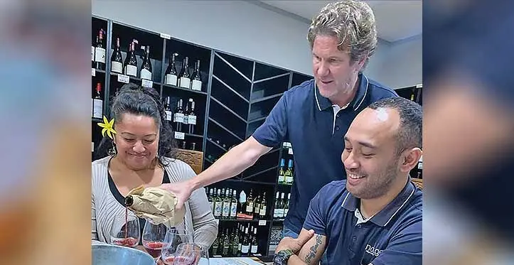 Lawhill Wines Fiji specialist and business development manager, Kelley Schaefer pouring wine into the wine glass of his participants.