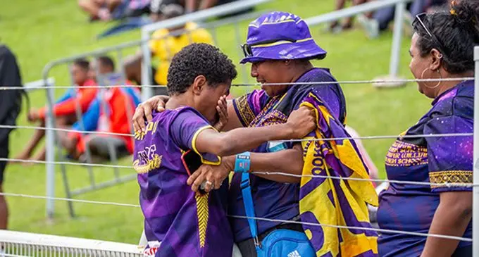 Makelesi Tuivuya of Jasper Williams High School celebrates her gold medal win with her coach at the HFC bank Stadium, Suva on August 19, 2022. Photo: Leon Lord