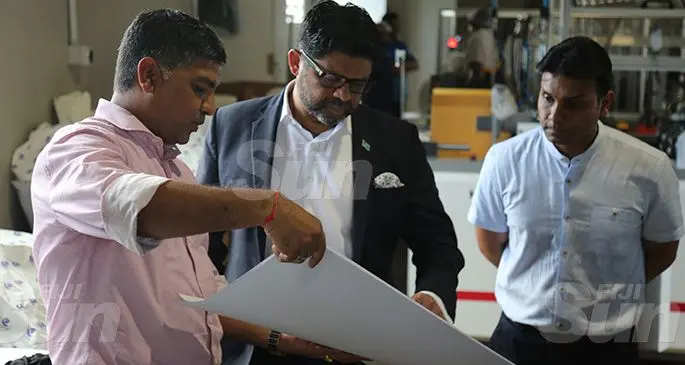 Star Printery Pte Limited directors Sandeep Chauhan (left) and Vikesh Chauhan with Attorney-General and Minister for Economy Aiyaz Sayed-Khaiyum while touring their new paper production factory on November 4, 2019. Photo: Inoke Rabonu