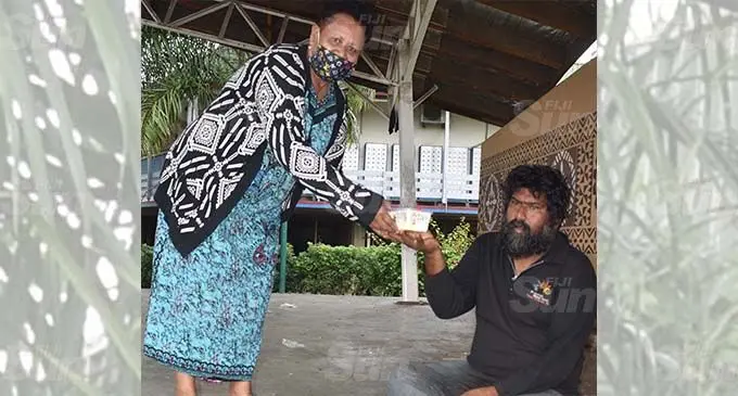 Emily Koti giving a food pack at Nadi town on September 9, 2021. Photo: Mereleki Nai