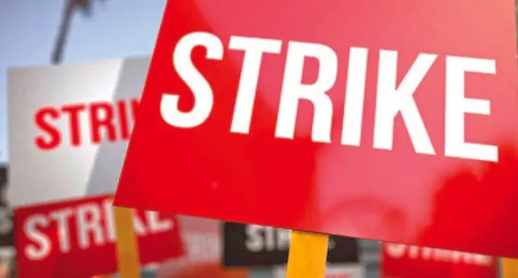 A red sign with the word STRIKE printed on it.