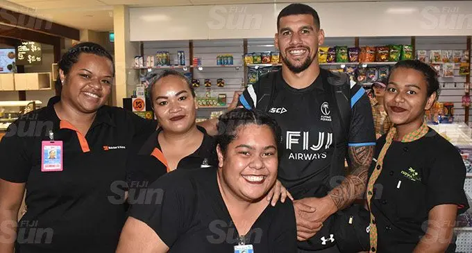 Fiji Airways Flying Fijians Josh Matavesi with fans at Nadi International Airport on September 1, 2019. Photo: Waisea Nasokia
